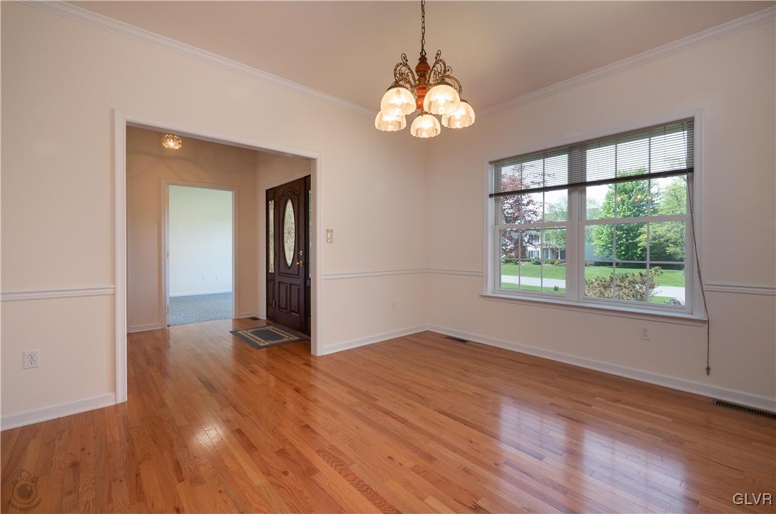 212 Bushkill Ridge Road Wind Gap, PA 18091 - Photo 7 of 36 a view of an empty room with wooden floor and a window