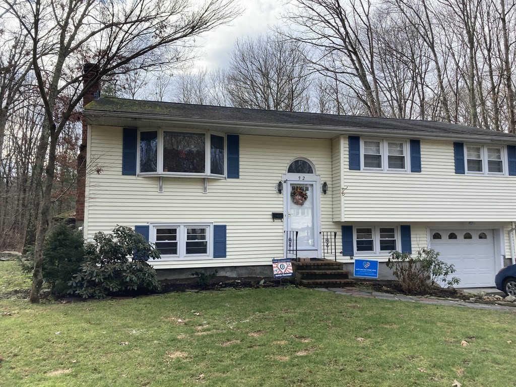 92 Deerfield Road Sharon, MA 02067 - Photo 1 of 18 a front view of a house with a garden