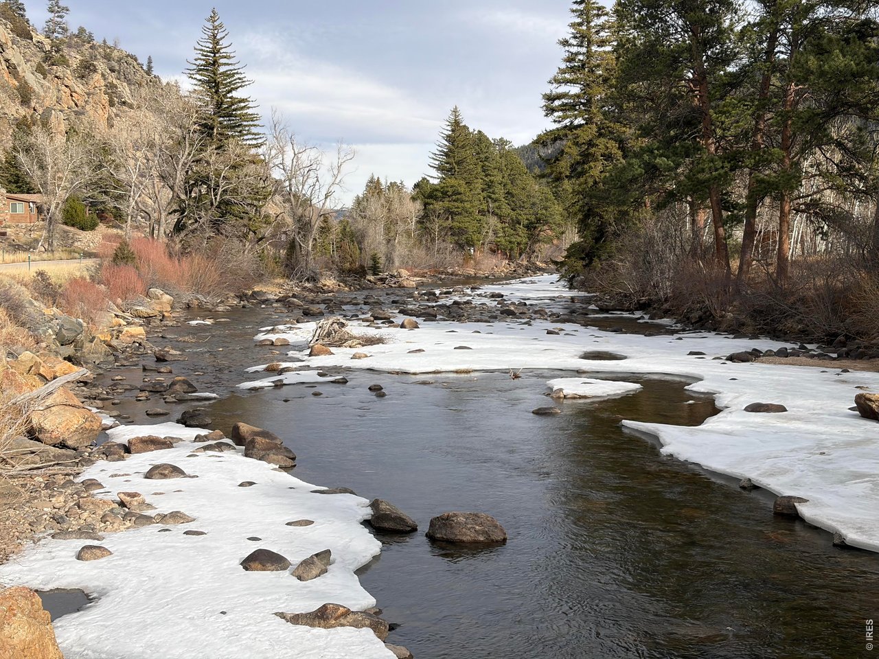 32370 Poudre Canyon Road Bellvue, CO 80512 - Photo 1 of 30 a view of a lake with beach