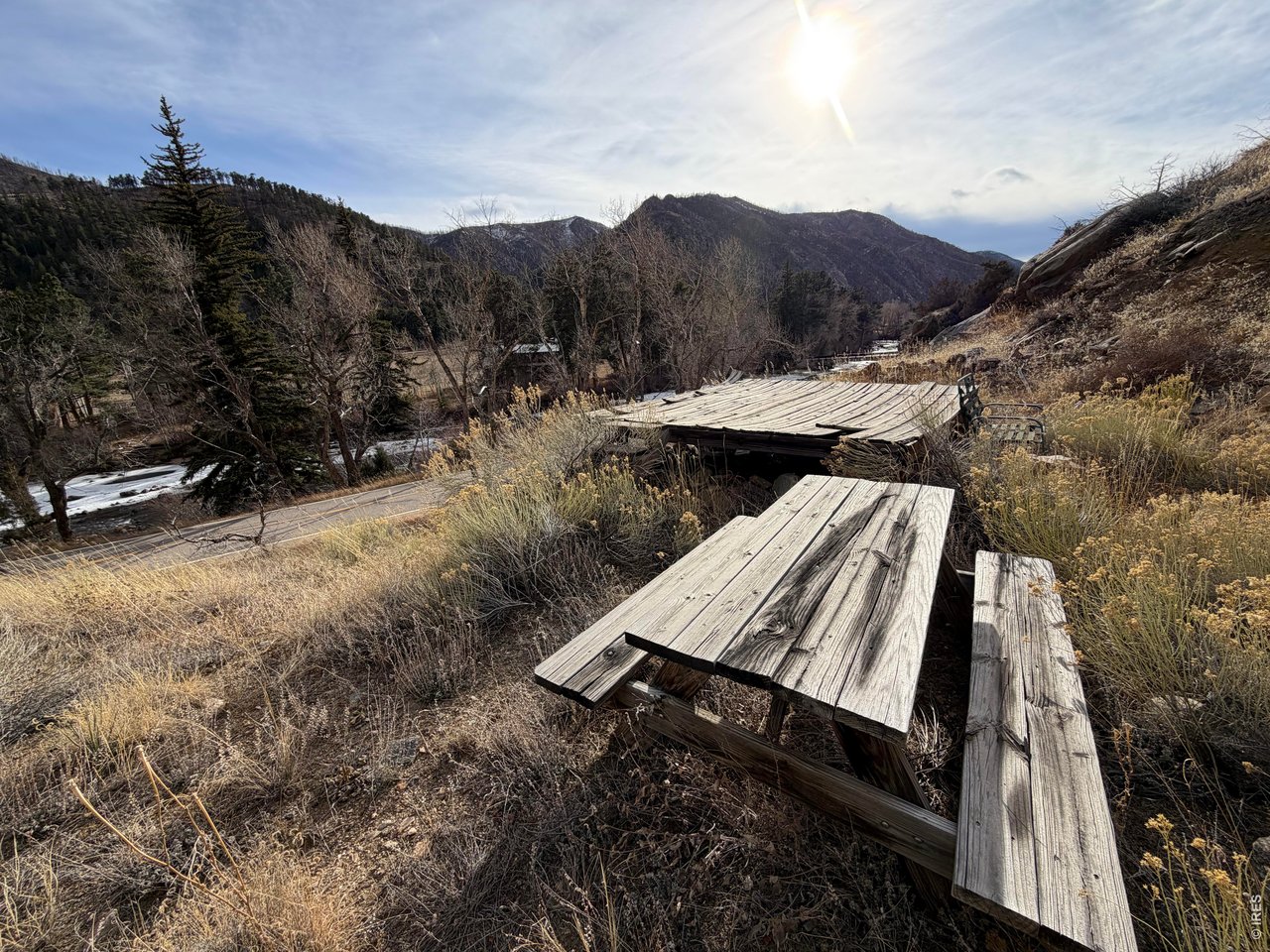 32370 Poudre Canyon Road Bellvue, CO 80512 - Photo 15 of 30 a view of a backyard with a patio