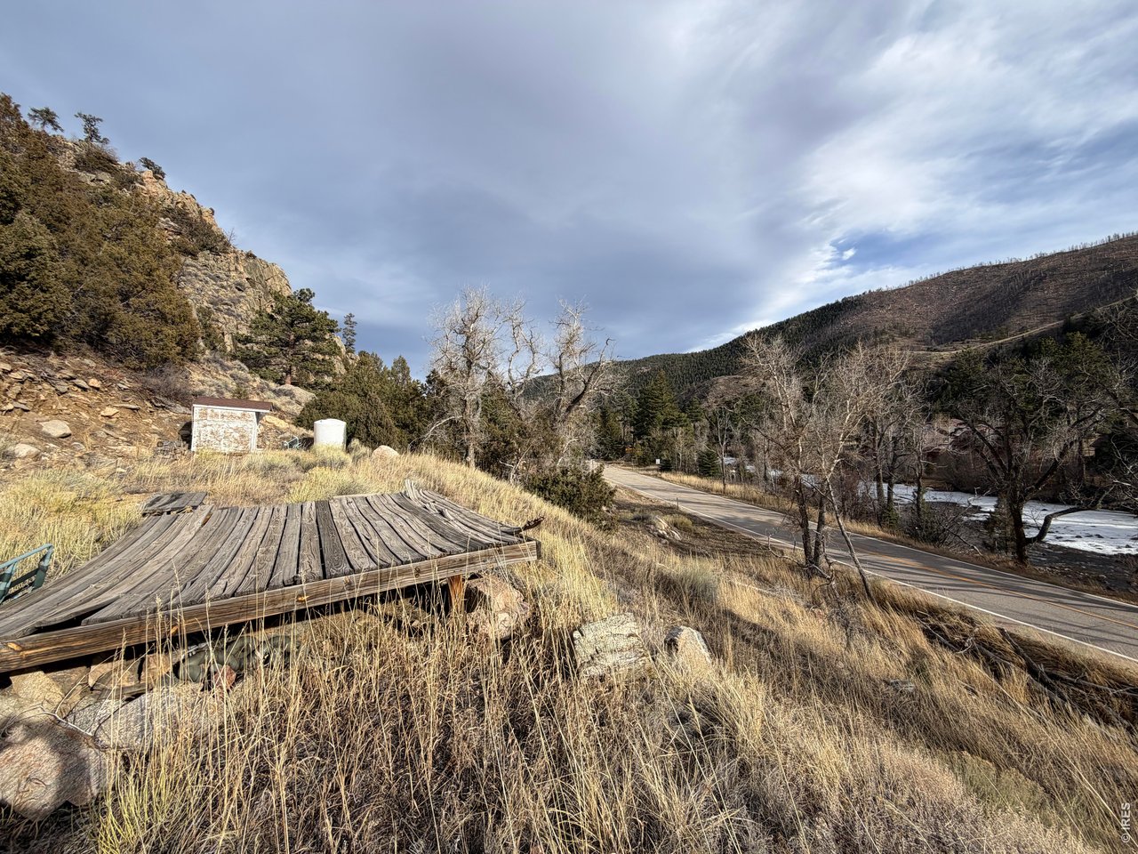 32370 Poudre Canyon Road Bellvue, CO 80512 - Photo 16 of 30 a view of a backyard with wooden fence