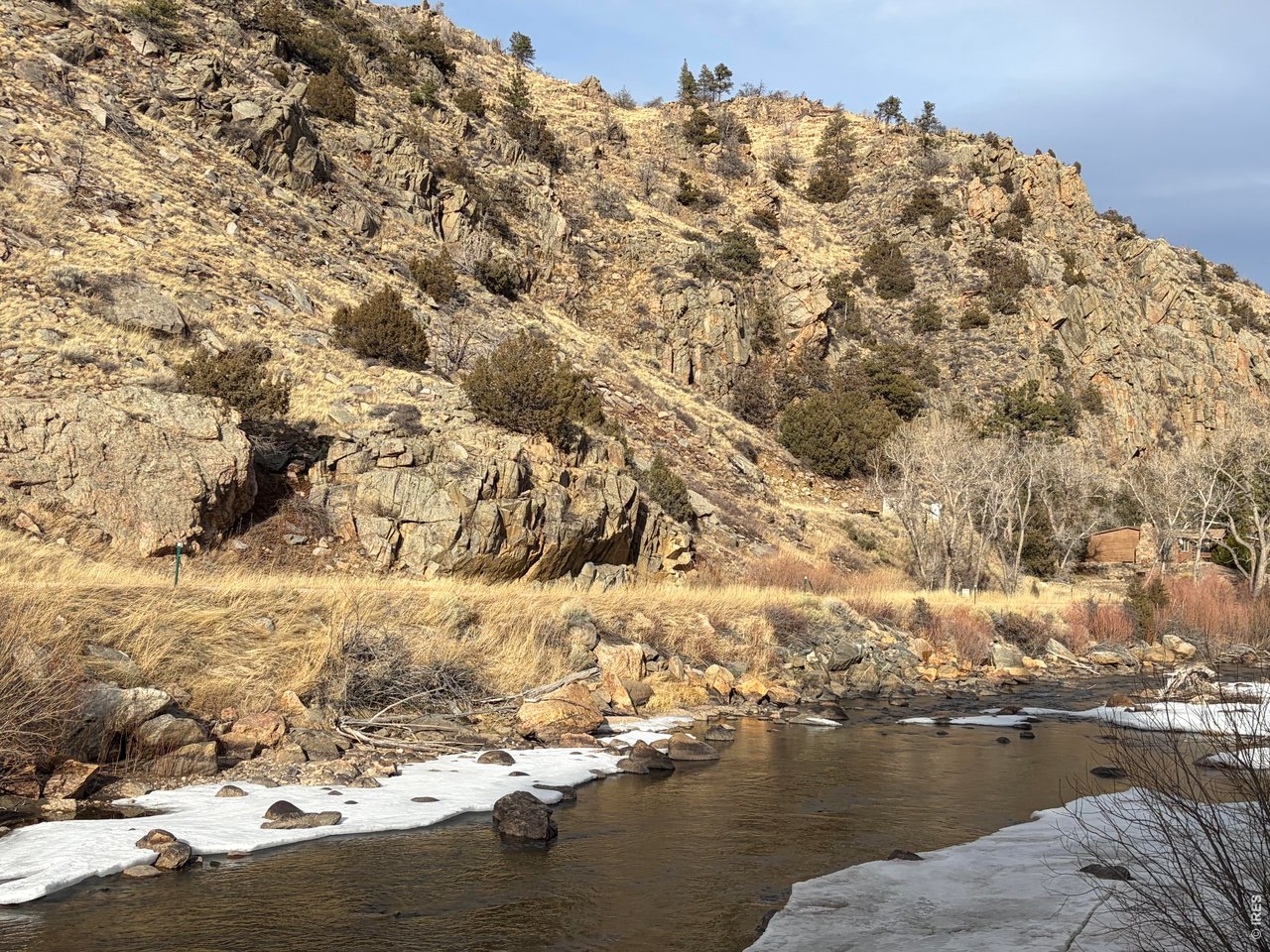 32370 Poudre Canyon Road Bellvue, CO 80512 - Photo 27 of 30 a view of a large body of water with a building in the background