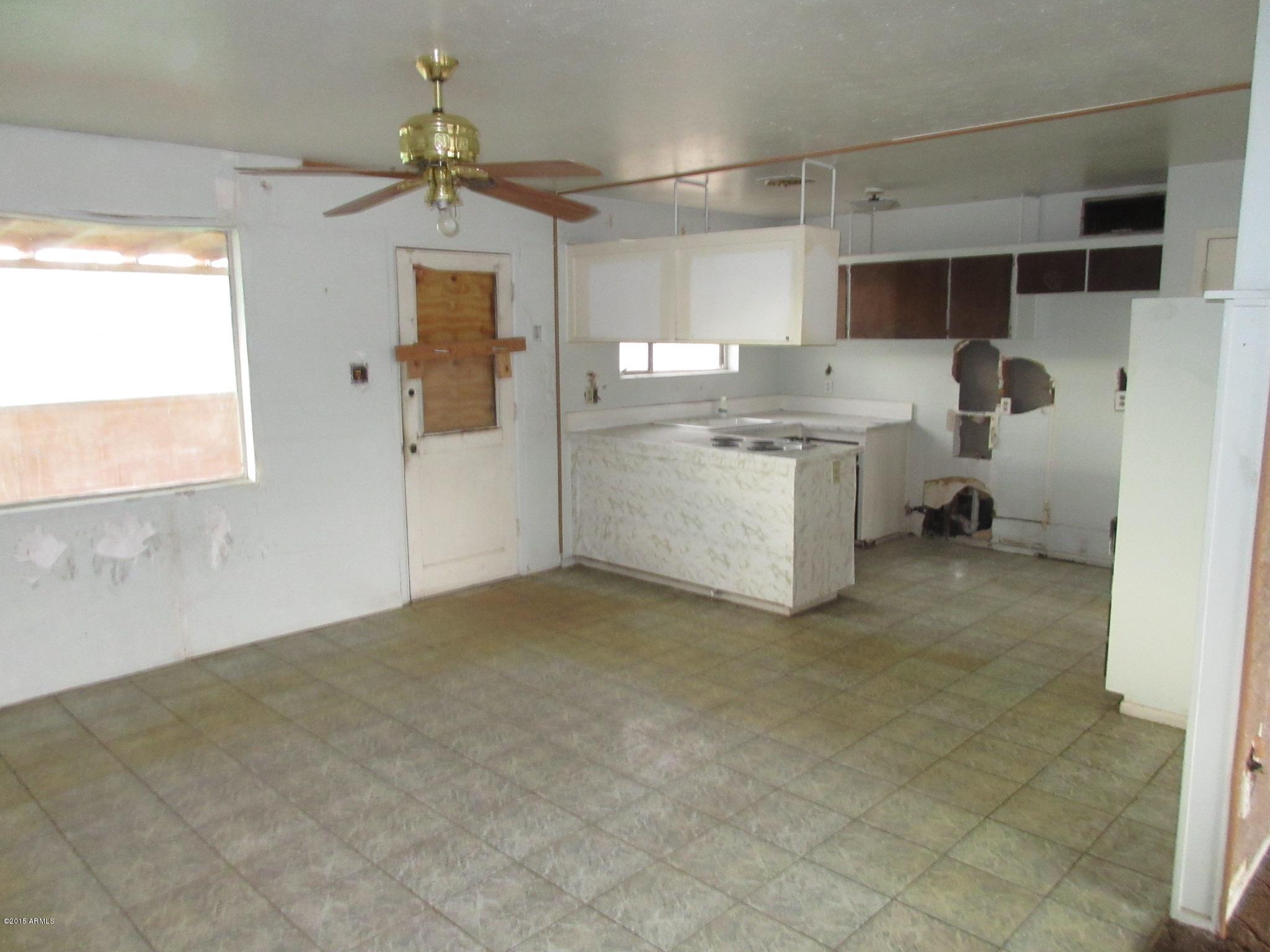5061 West Osborn Road Phoenix, AZ 85031 - Photo 4 of 10 DINING AREA INTO KITCHEN