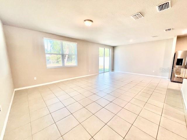 1251 McNeal Road Spring Hill, FL 34608 - Photo 16 of 46 a view of an empty room with a window