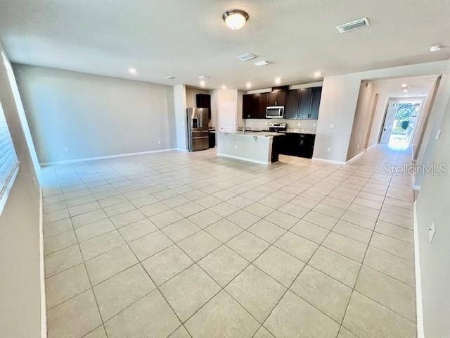 1251 McNeal Road Spring Hill, FL 34608 - Photo 17 of 46 a view of a kitchen with furniture and a kitchen