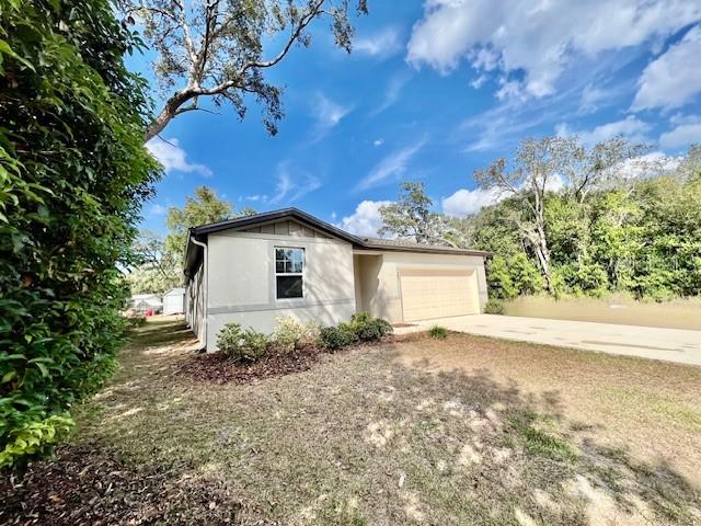 1251 McNeal Road Spring Hill, FL 34608 - Photo 2 of 46 a view of backyard of house