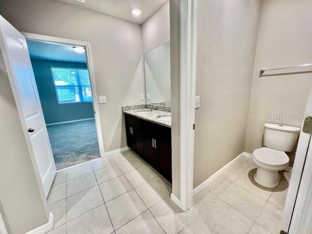 1251 McNeal Road Spring Hill, FL 34608 - Photo 23 of 46 a bathroom with a sink and a mirror