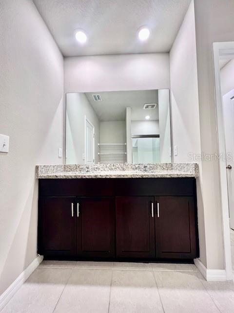 1251 McNeal Road Spring Hill, FL 34608 - Photo 24 of 46 a bathroom with a sink double vanity and a mirror