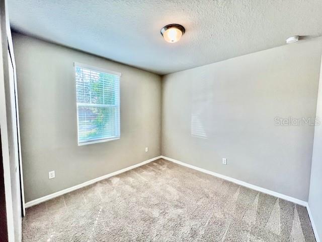 1251 McNeal Road Spring Hill, FL 34608 - Photo 30 of 46 an empty room with windows