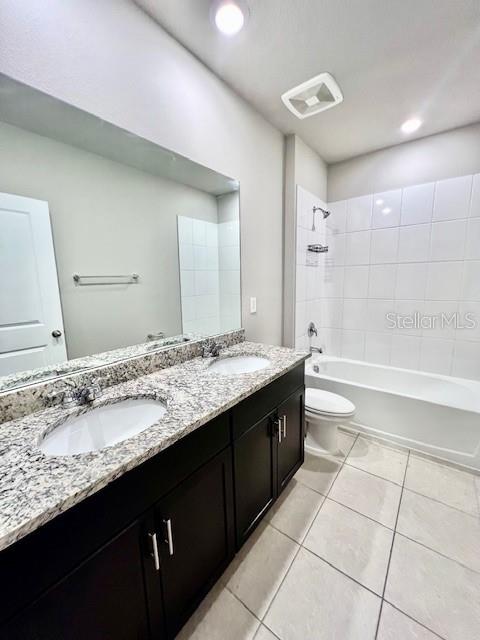 1251 McNeal Road Spring Hill, FL 34608 - Photo 37 of 46 a bathroom with a granite countertop bathtub sink vanity and mirror