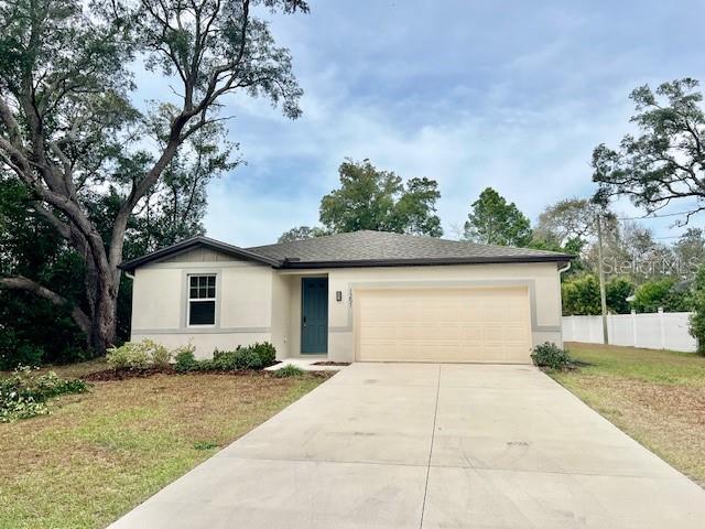 1251 McNeal Road Spring Hill, FL 34608 - Photo 42 of 46 a house with a outdoor space