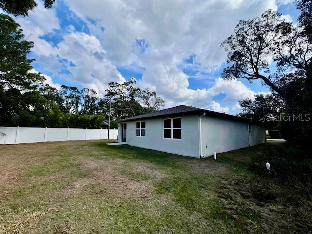 1251 McNeal Road Spring Hill, FL 34608 - Photo 45 of 46 a backyard of a house with lots of green space