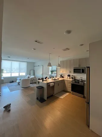 a kitchen with sink refrigerator and stove