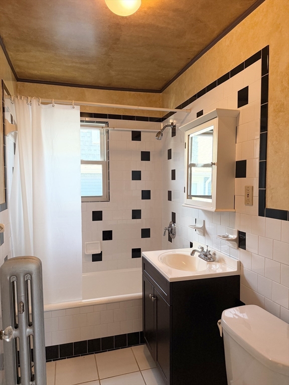 157 Hillside Street, Unit 2 Boston, MA 02120 - Photo 13 of 17 a bathroom with a sink toilet and shower