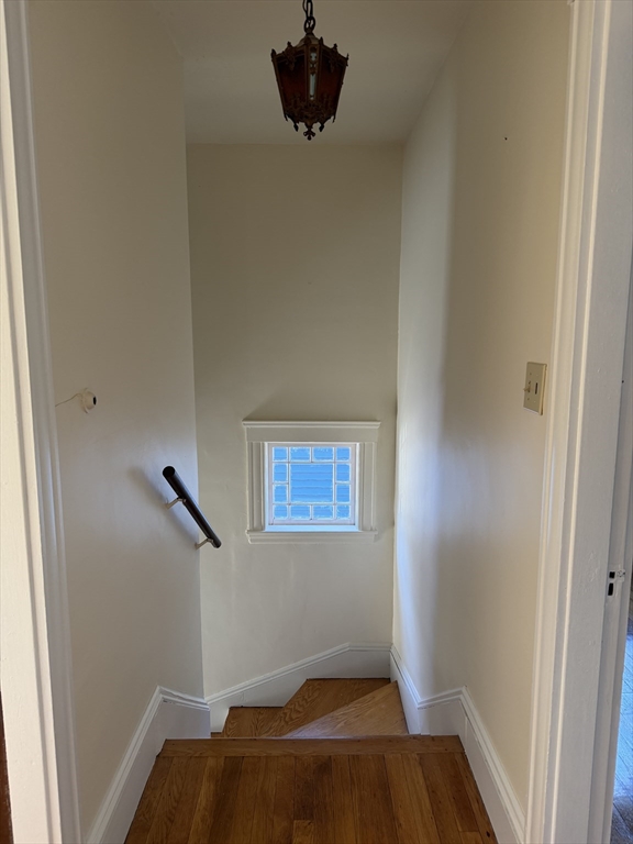 157 Hillside Street, Unit 2 Boston, MA 02120 - Photo 14 of 17 a view of a livingroom with wooden floor and a window