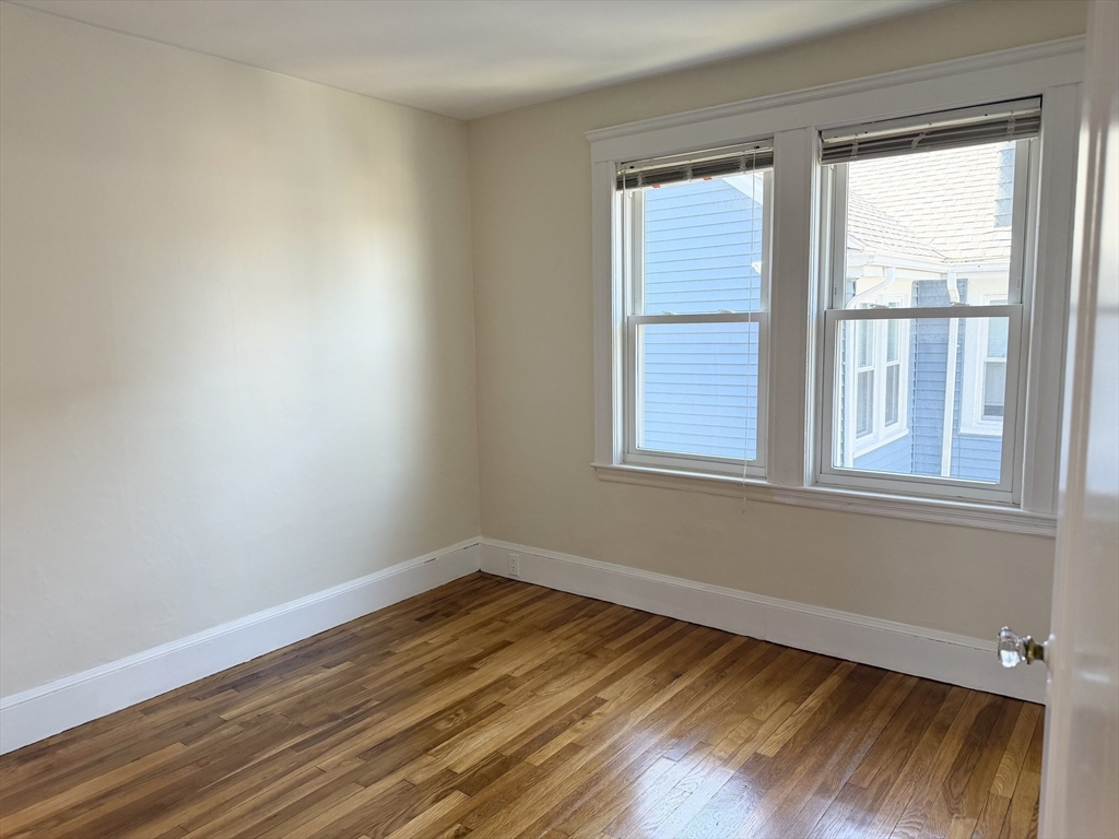 157 Hillside Street, Unit 2 Boston, MA 02120 - Photo 8 of 17 a view of a room with wooden floor and windows