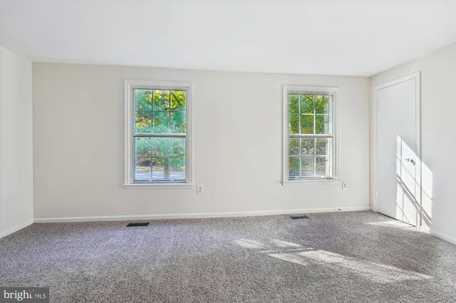 an empty room with windows