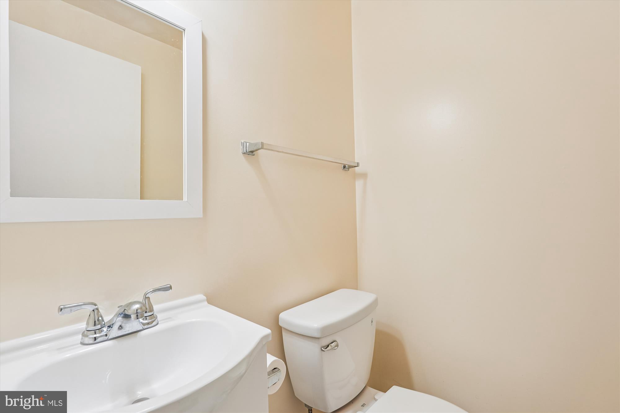 10602 Chisholm Landing Terrace Gaithersburg, MD 20878 - Photo 7 of 46 a white toilet sitting next to a bathroom sink