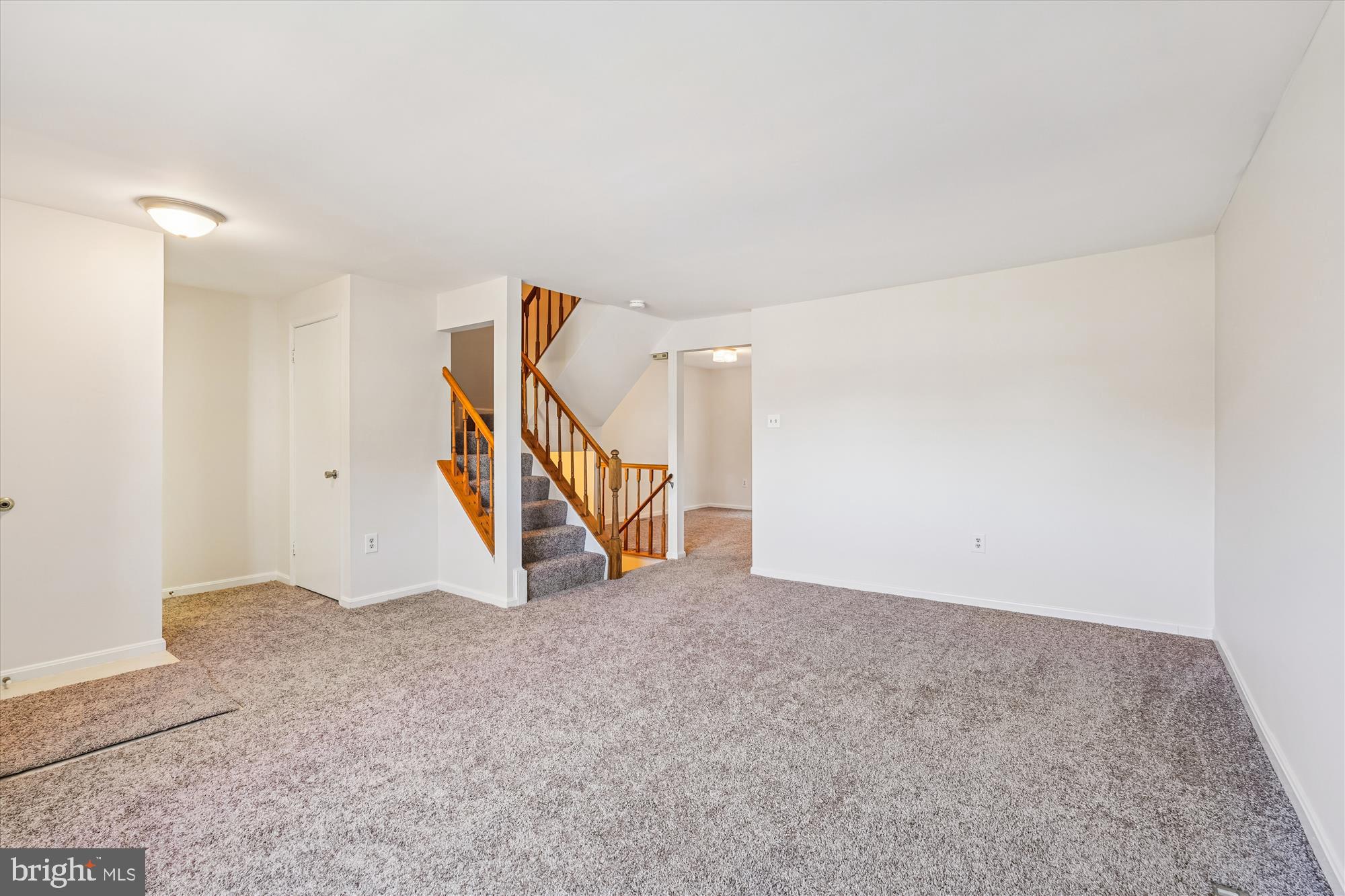 10602 Chisholm Landing Terrace Gaithersburg, MD 20878 - Photo 8 of 46 a view of an empty room with stairs