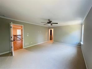 2326 Portrush Way Southeast Atlanta, GA 30339 - Photo 5 of 11 an empty room with a empty space and chandelier fan