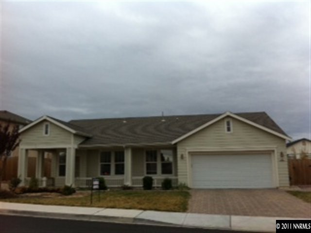876 North University Park Loop Reno, NV 89512 - Photo 1 of 9 a front view of a house with yard