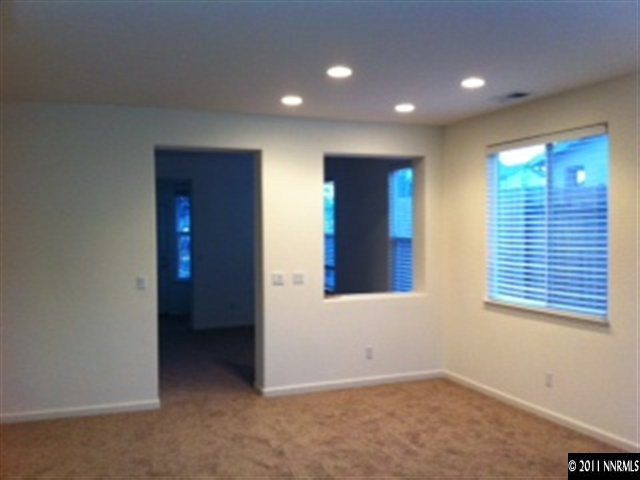 876 North University Park Loop Reno, NV 89512 - Photo 4 of 9 an empty room with windows and entrance