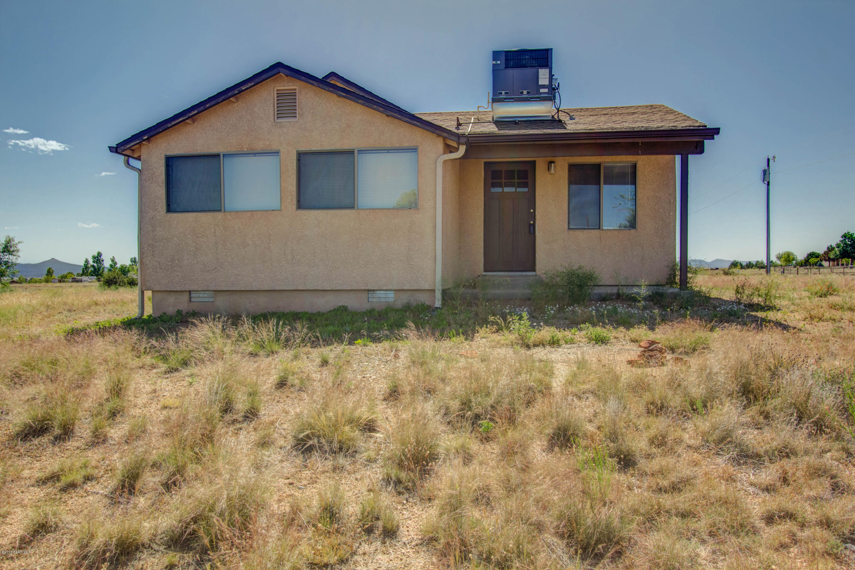 575 West Iris Road Paulden, AZ 86334 - Photo 1 of 18 a front view of a house with a yard