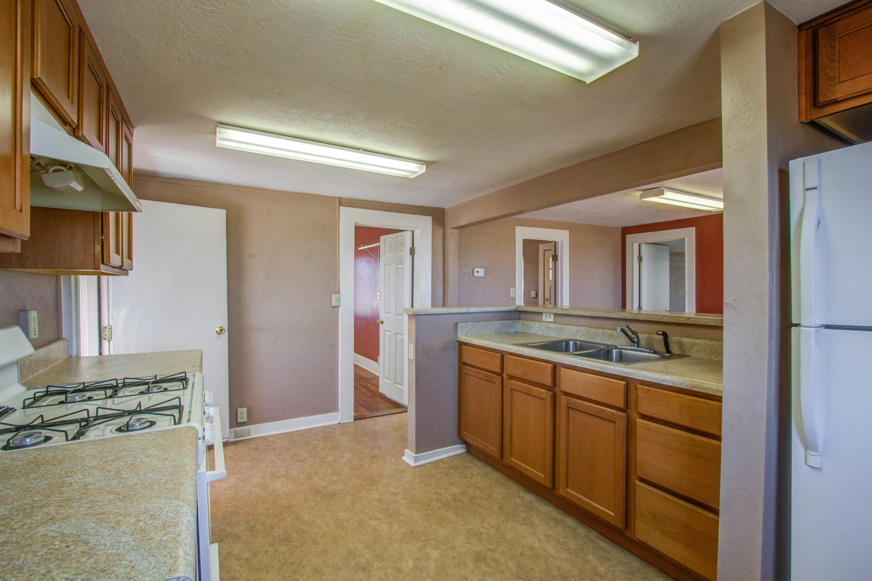 575 West Iris Road Paulden, AZ 86334 - Photo 12 of 18 a bathroom with a granite countertop sink and a mirror