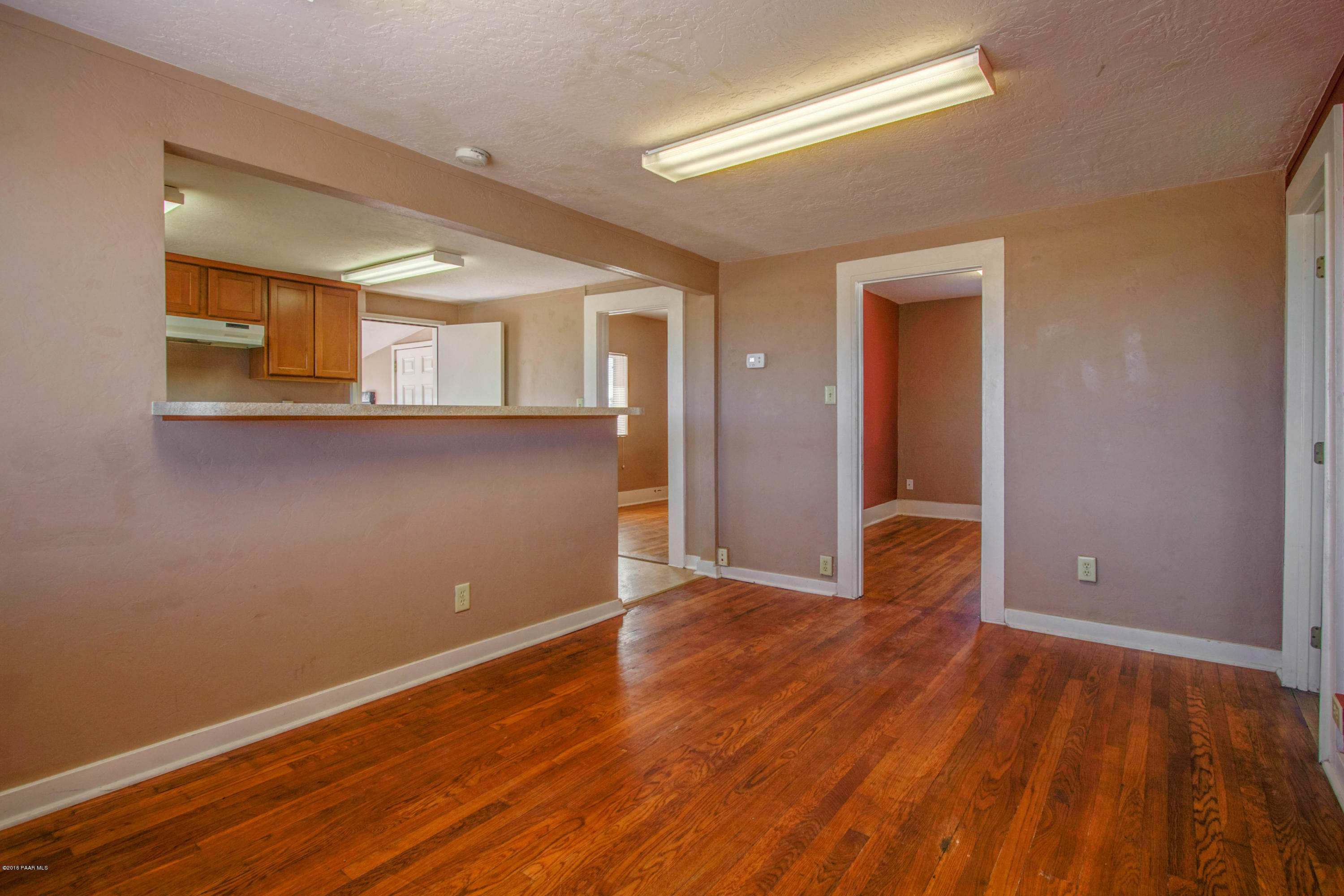 575 West Iris Road Paulden, AZ 86334 - Photo 14 of 18 a view of an empty room with wooden floor and a window