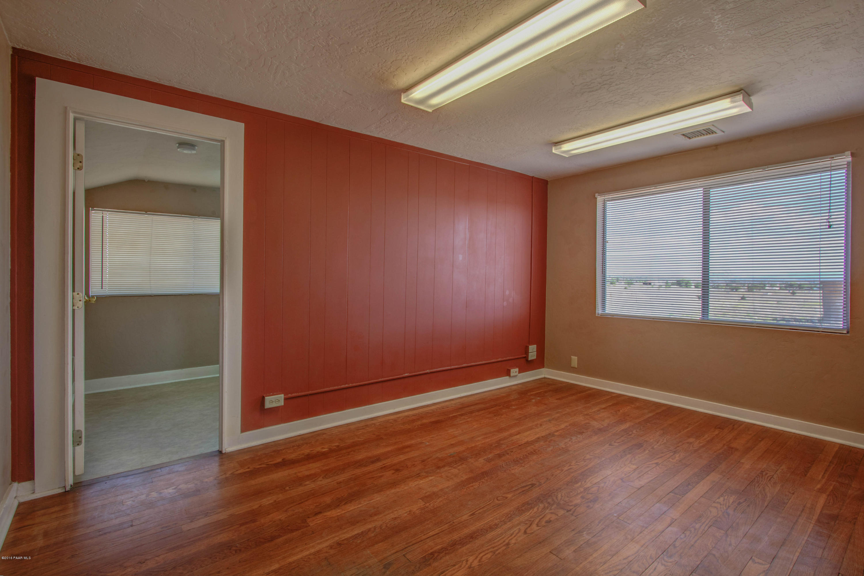 575 West Iris Road Paulden, AZ 86334 - Photo 16 of 18 a view of an empty room with wooden floor and a window