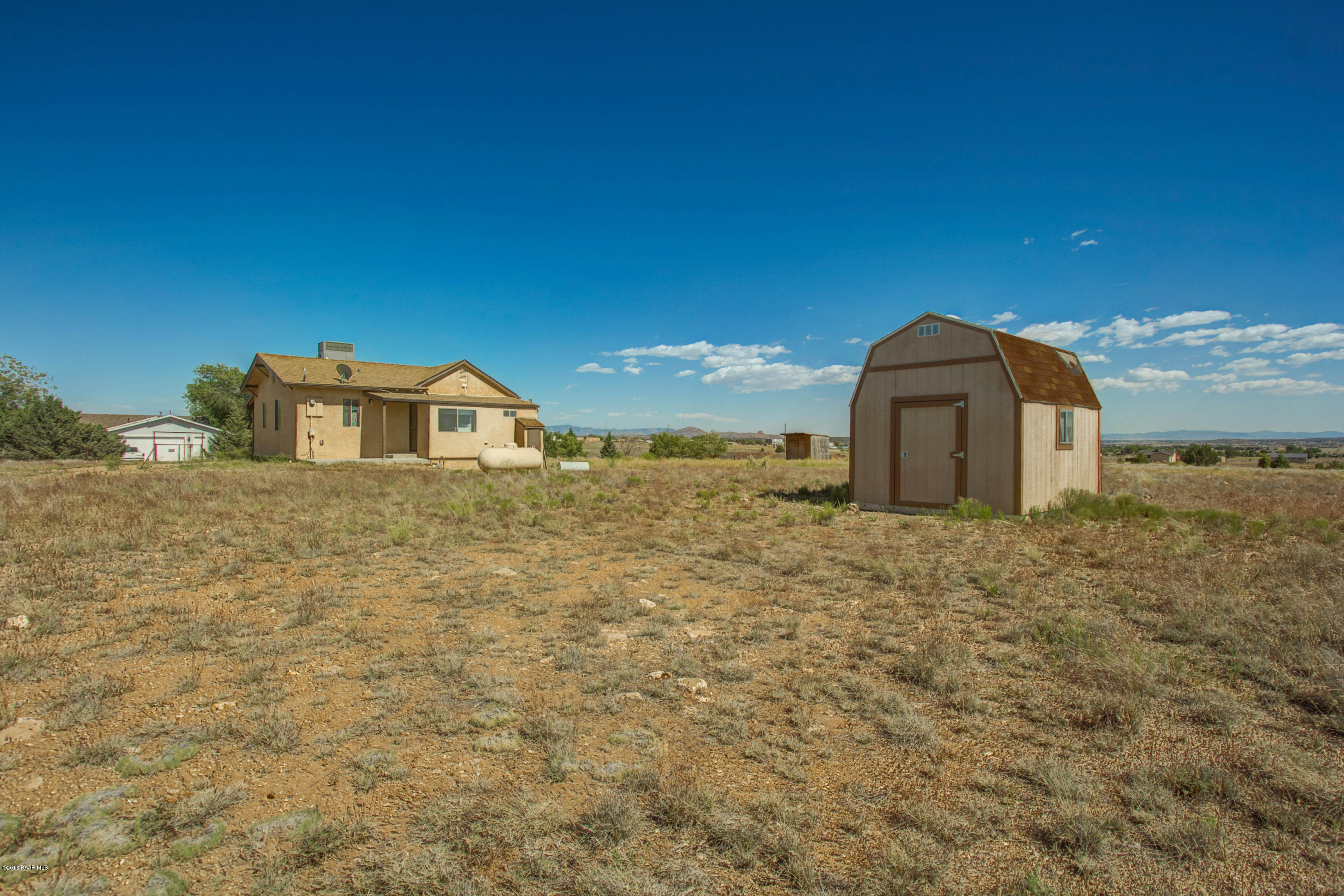 575 West Iris Road Paulden, AZ 86334 - Photo 18 of 18 a view of a dry yard with wooden fence