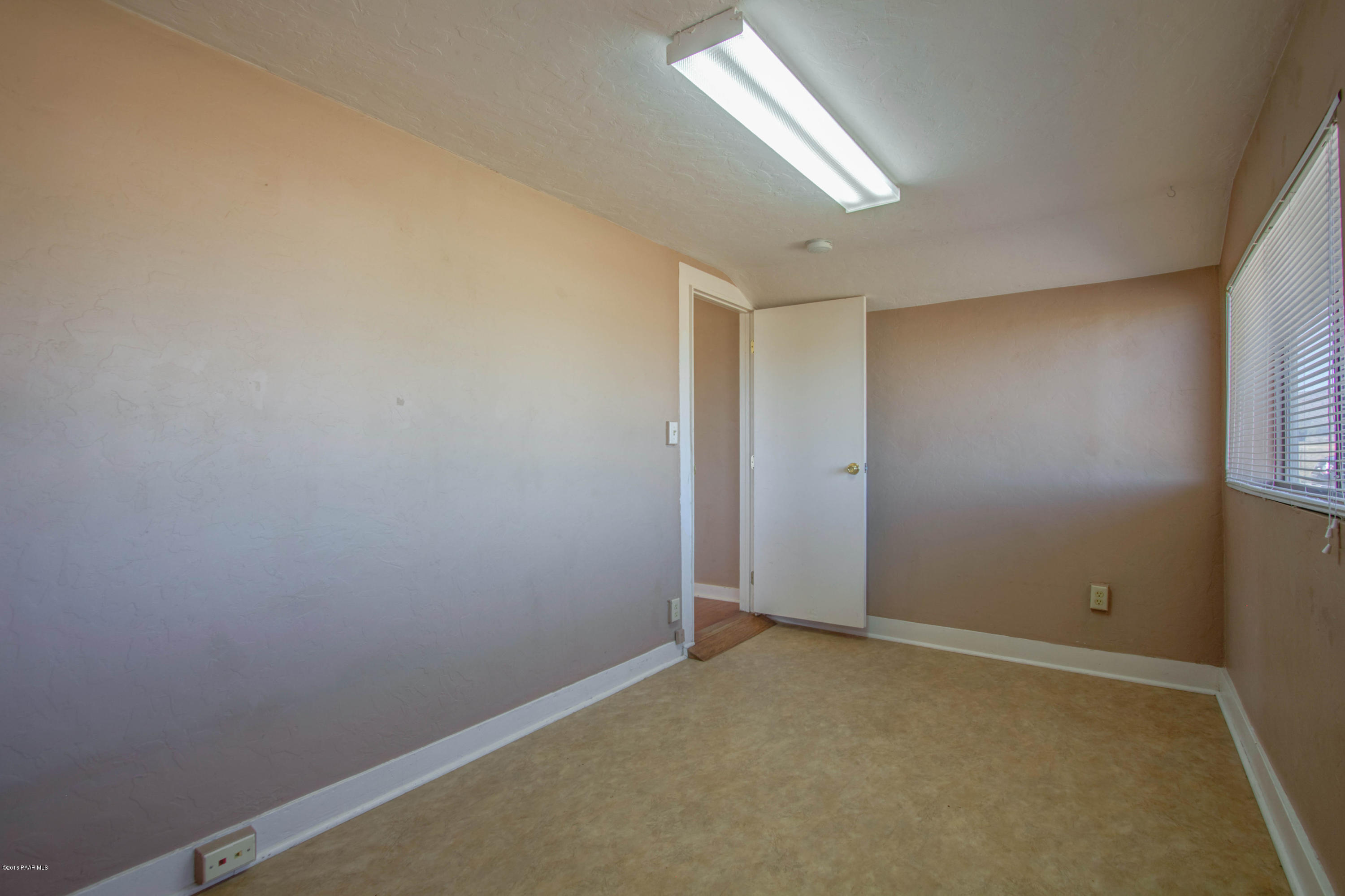 575 West Iris Road Paulden, AZ 86334 - Photo 4 of 18 an empty room with windows