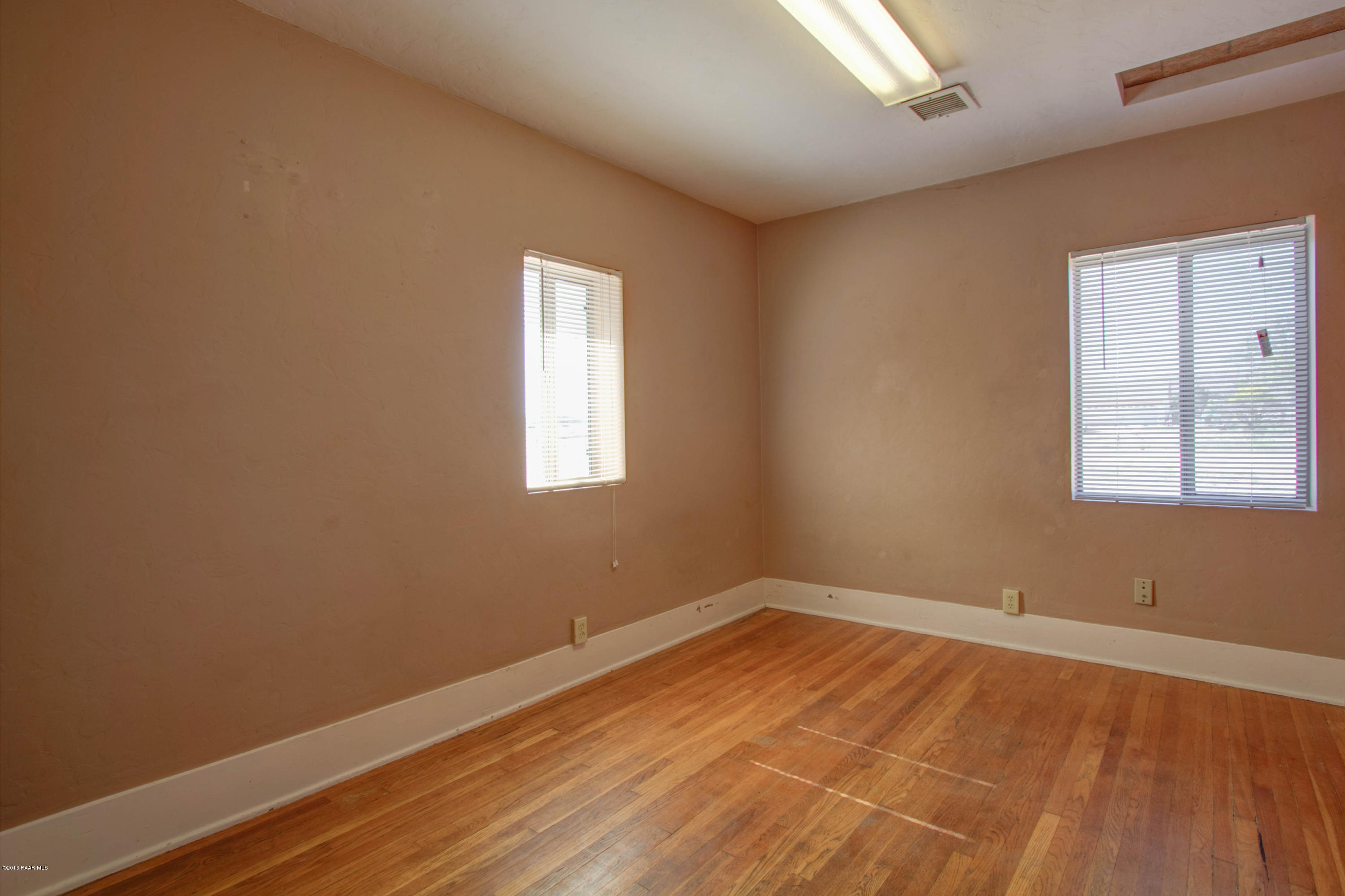 575 West Iris Road Paulden, AZ 86334 - Photo 5 of 18 a view of a room with wooden floor and windows