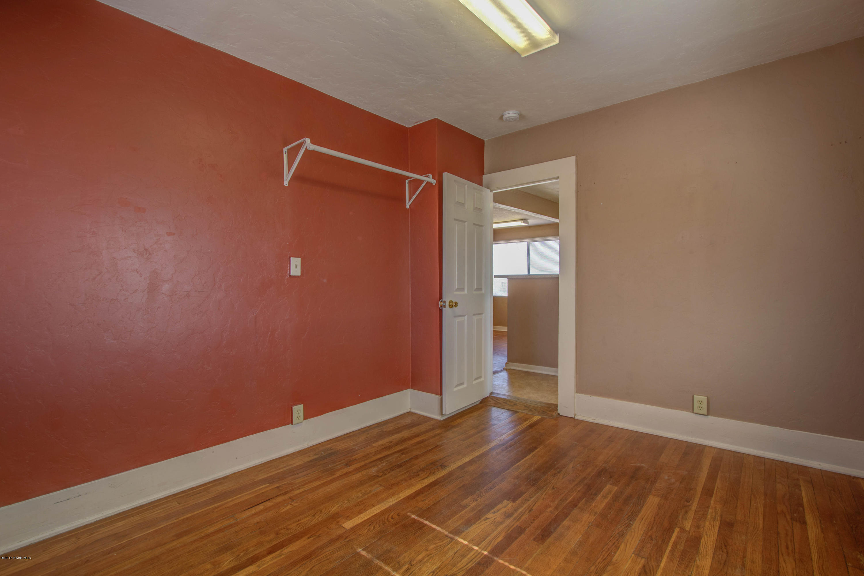 575 West Iris Road Paulden, AZ 86334 - Photo 7 of 18 a view of an empty room with wooden floor and closet
