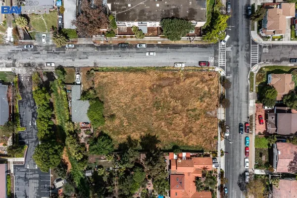 a swimming pool with trees in the background