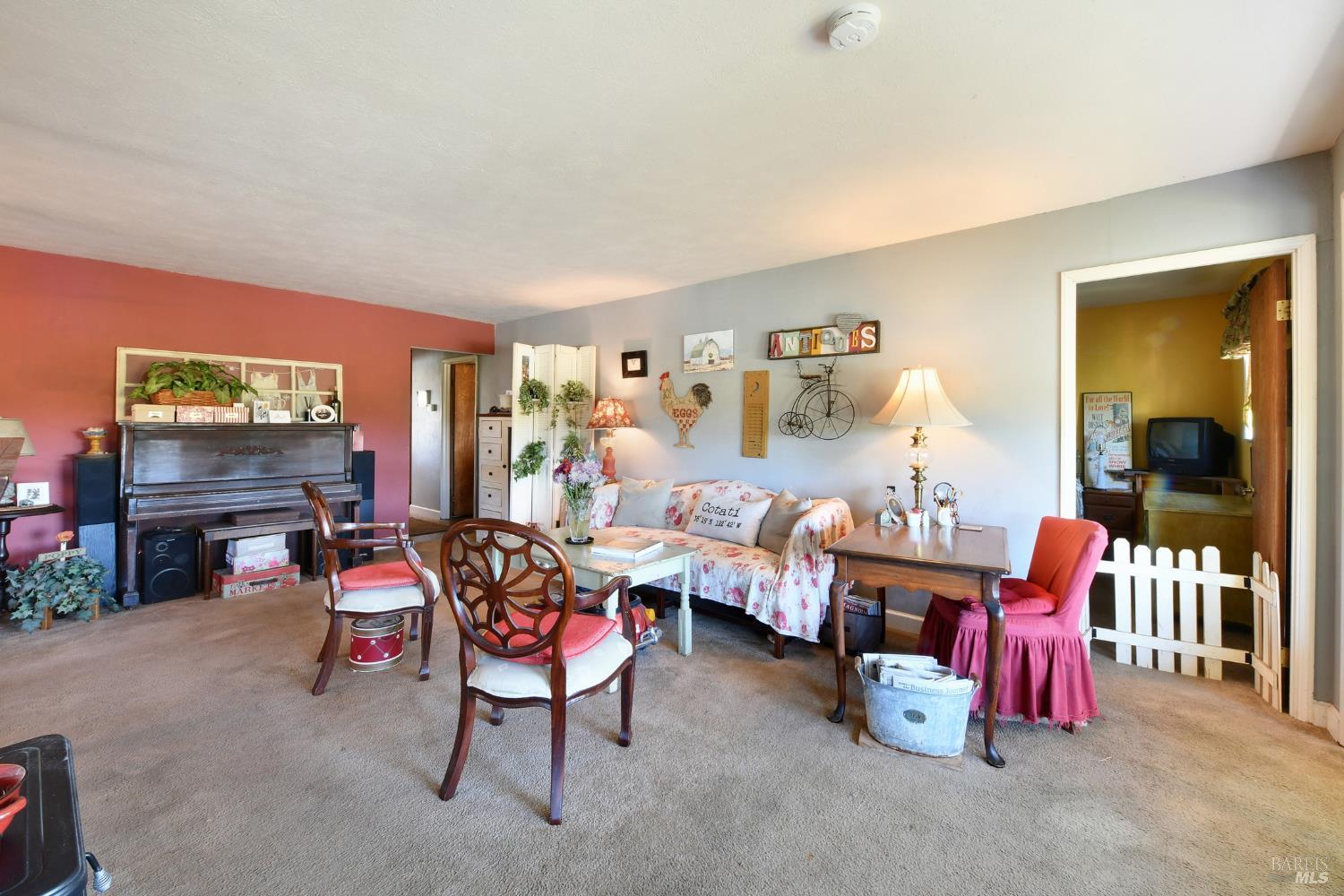 148 Millbrae Avenue Santa Rosa, CA 95407 - Photo 12 of 29 a living room with furniture and a flat screen tv