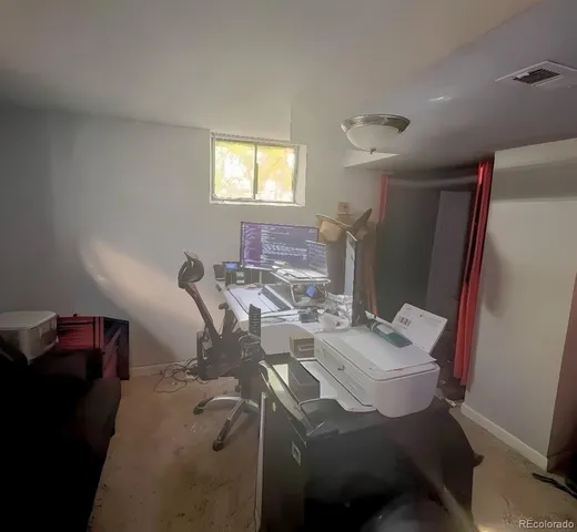 a workspace with furniture and window