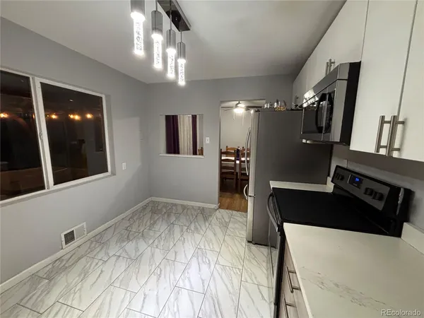 a bedroom with a bed and a large mirror