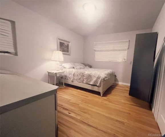 a bedroom with a bed and a table