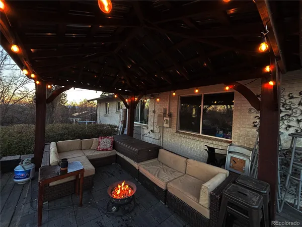 a outdoor living space with patio furniture and a potted plant