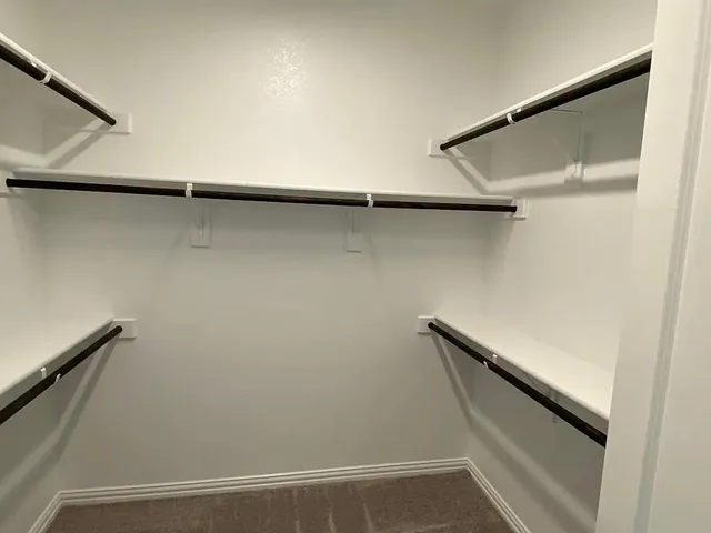 a kitchen with stainless steel appliances granite countertop a sink a stove and a wooden floor