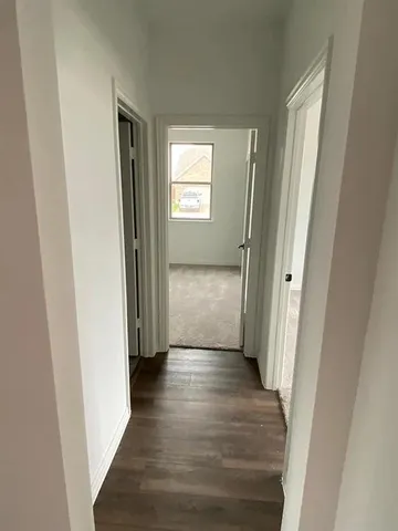 a white toilet sitting next to a sink