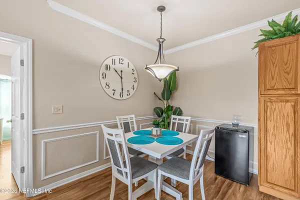 a front view of a house with a garden and patio