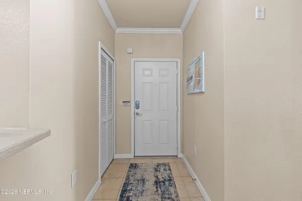 a bathroom with a granite countertop sink a toilet a mirror a bathtub and shower