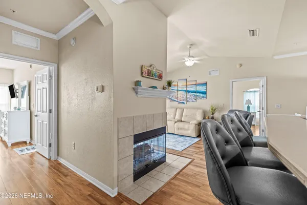 an aerial view of a house with a yard and lake view