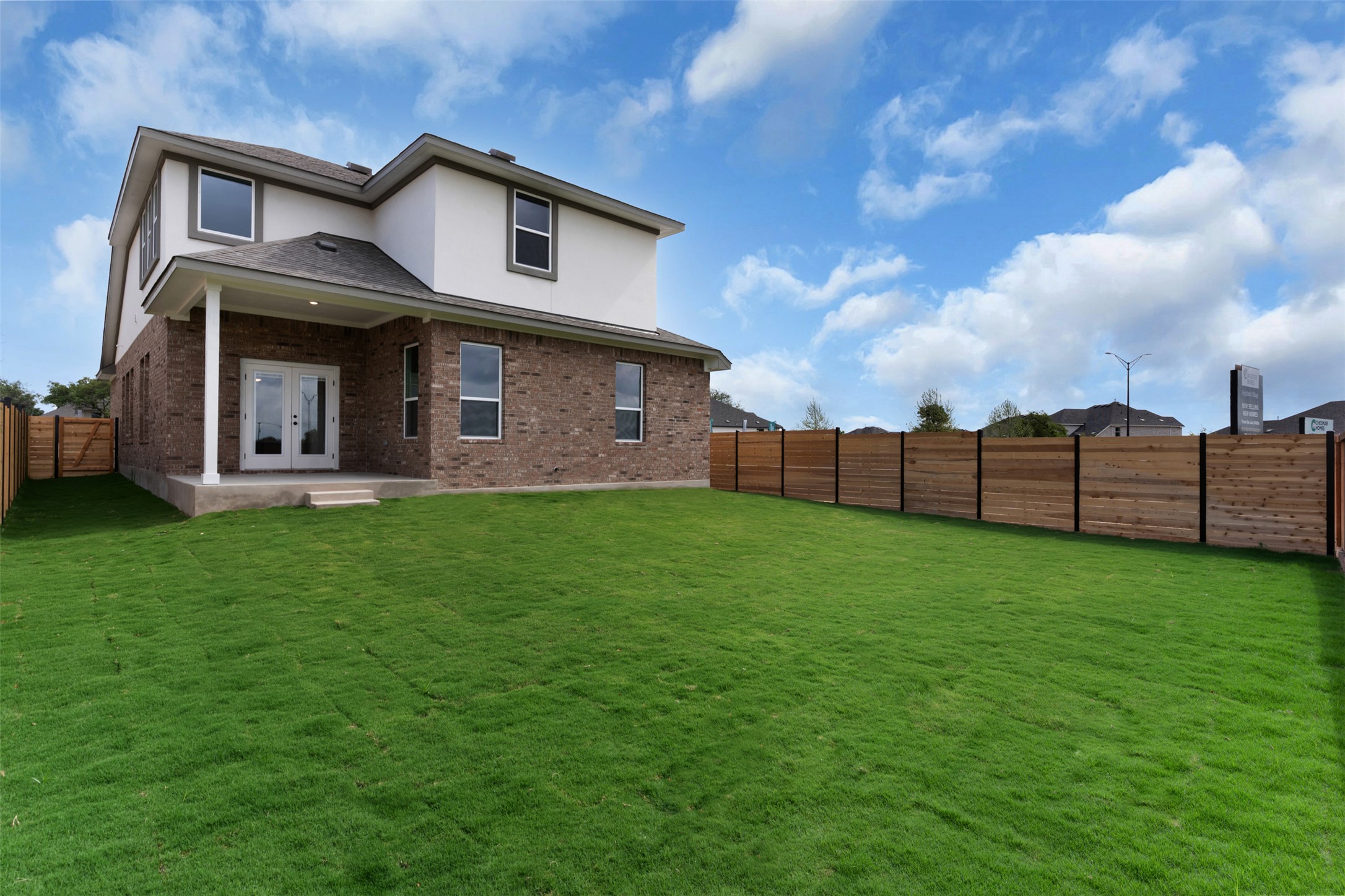 405 Raleigh Drive Georgetown, TX 78633 - Photo 20 of 27 Back of house featuring french doors, a fenced backyard, a patio area, stucco siding, and brick siding