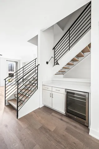 a view of a kitchen with cabinets and stainless steel appliances