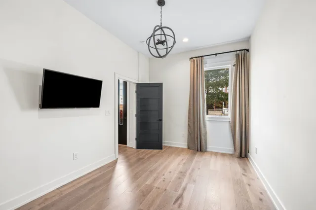 a view of a livingroom with wooden floor