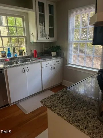 a kitchen with sink and window