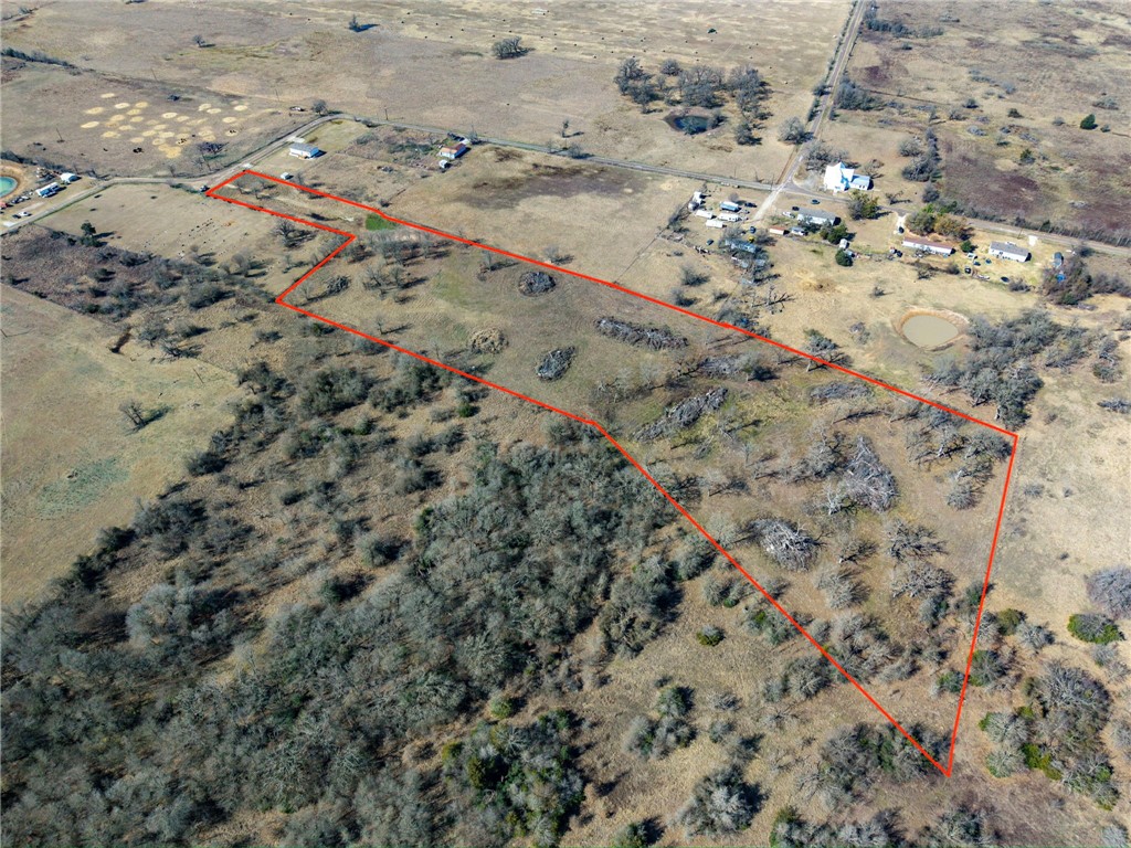a view of aerial view of a backyard of the house